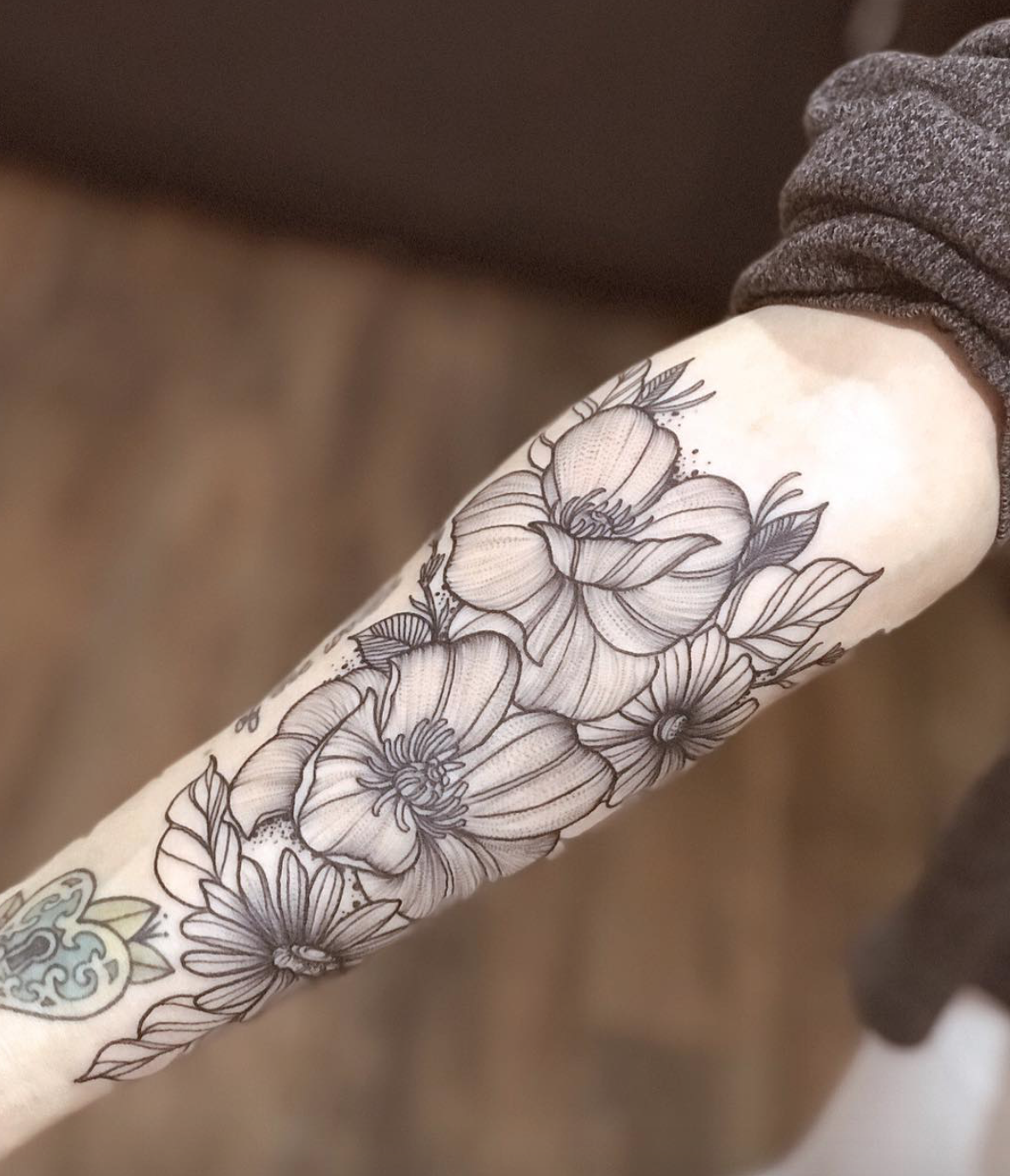 Chloe Jackson-Courteau floral tattoo