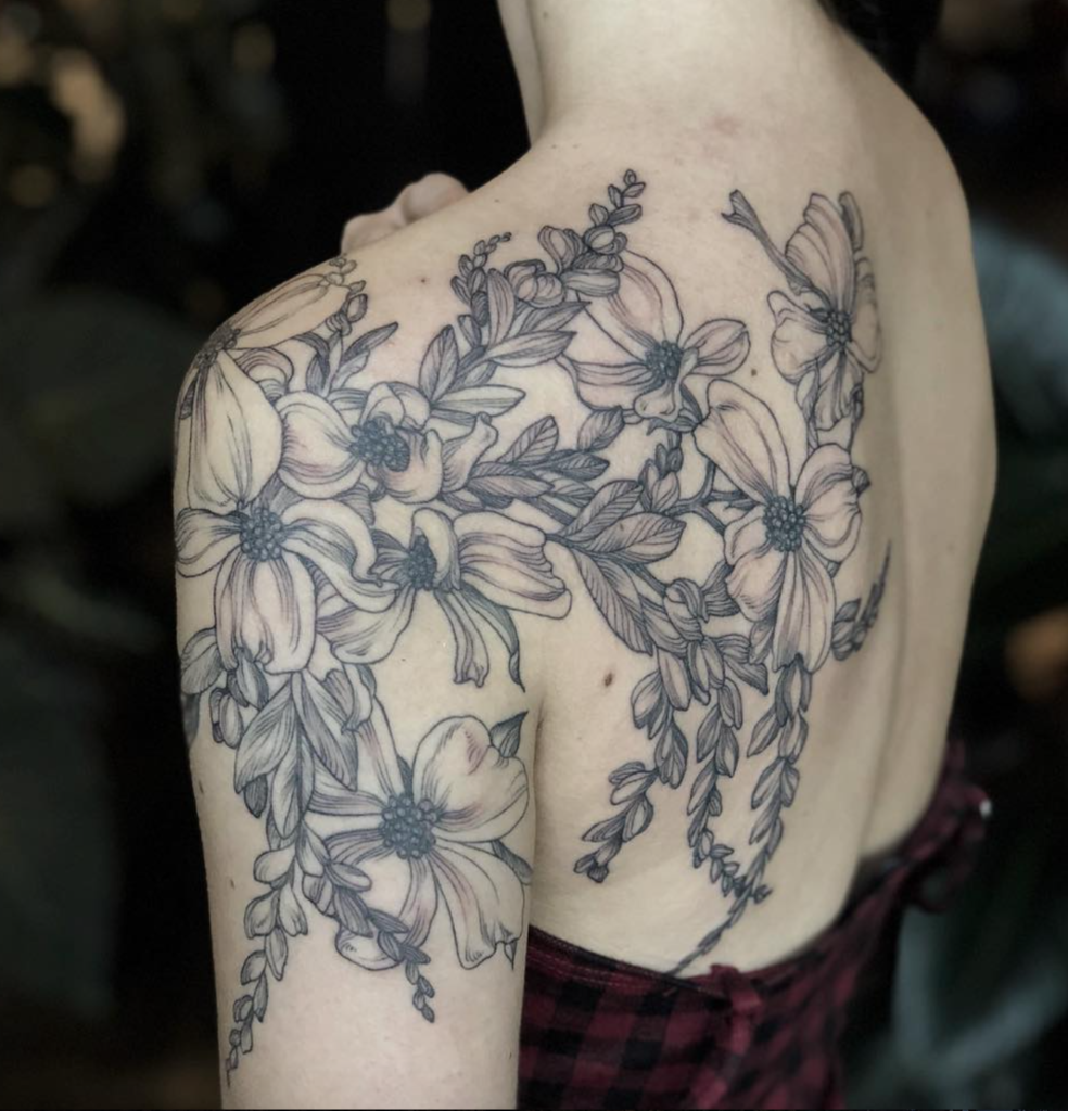 Cloey Zikmund floral shoulder tattoo