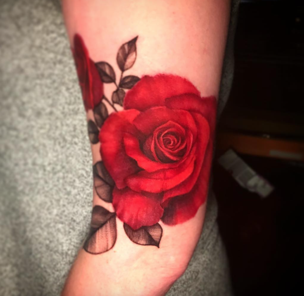 Deanna Smith red rose tattoo