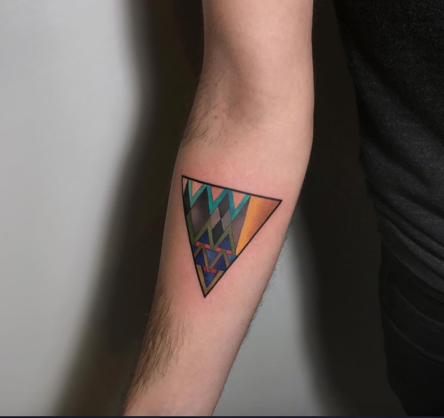 Amanda Wachob triangle tattoo
