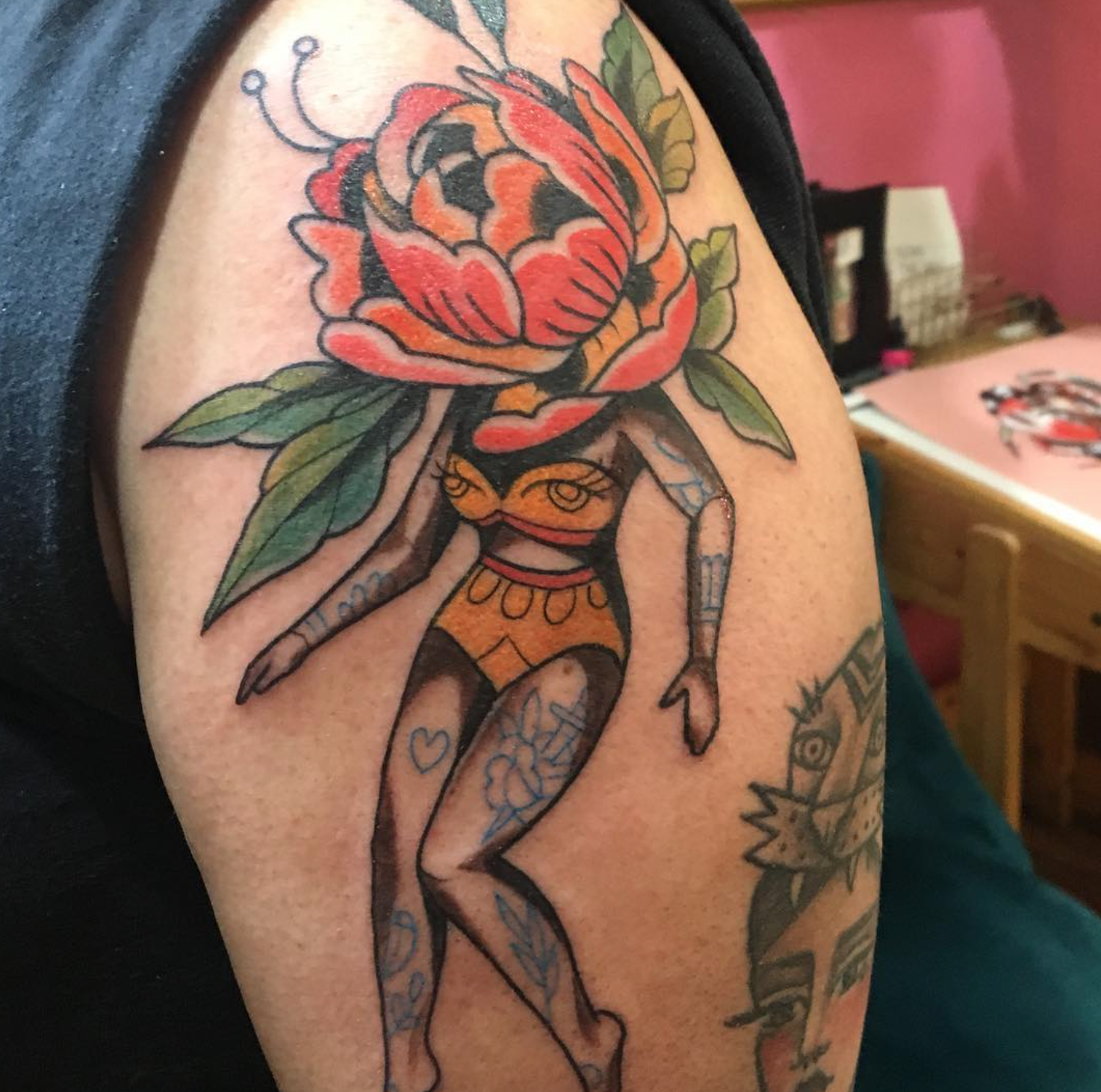 Emilie Robinson red floral babe tattoo