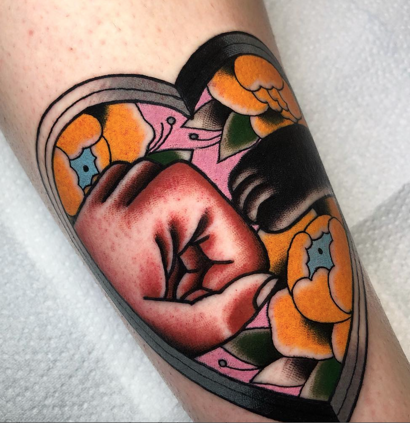 Iris Lys paw and hand tattoo