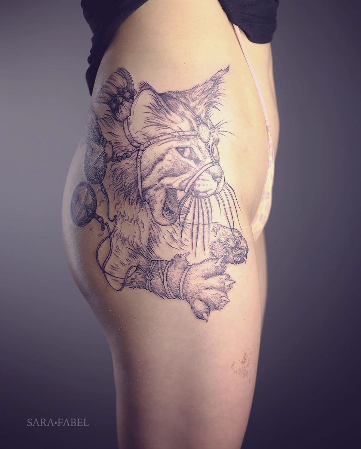 Sara Fabel cat tattoo