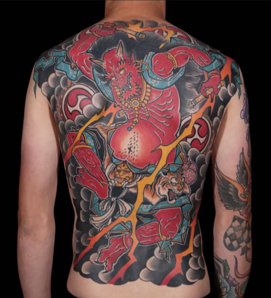 Laura Marie winning backpiece tattoo