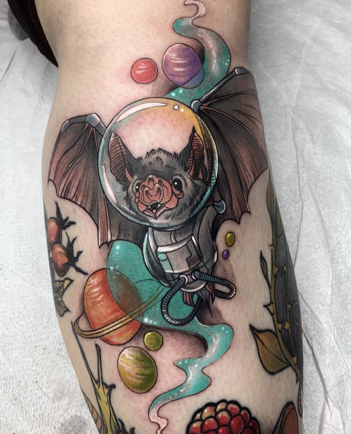 Astronaut bat tattoo