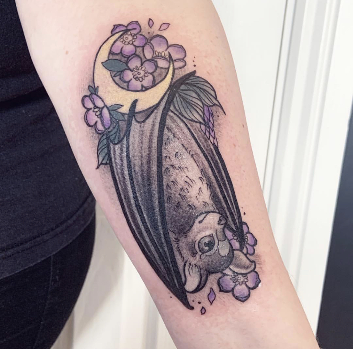 Bat and crescent moon tattoo