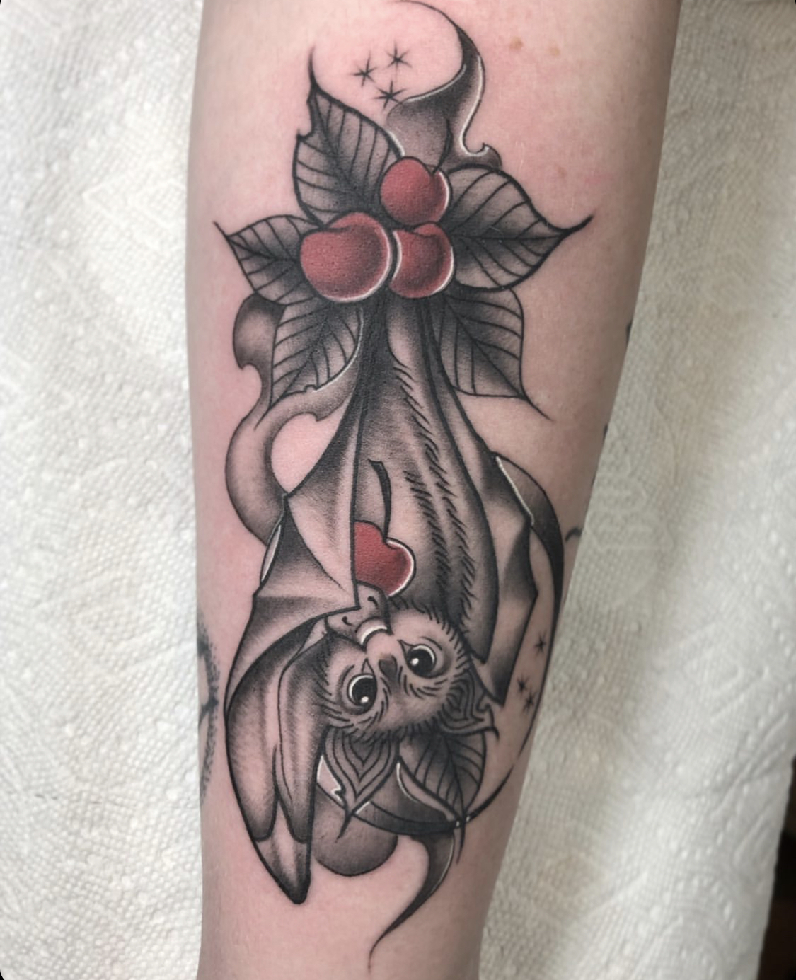 bat hanging upside down tattoo