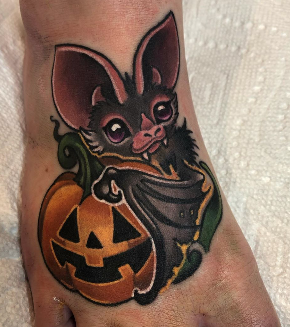 Bat and pumpkin tattoo by Alexandra Fische