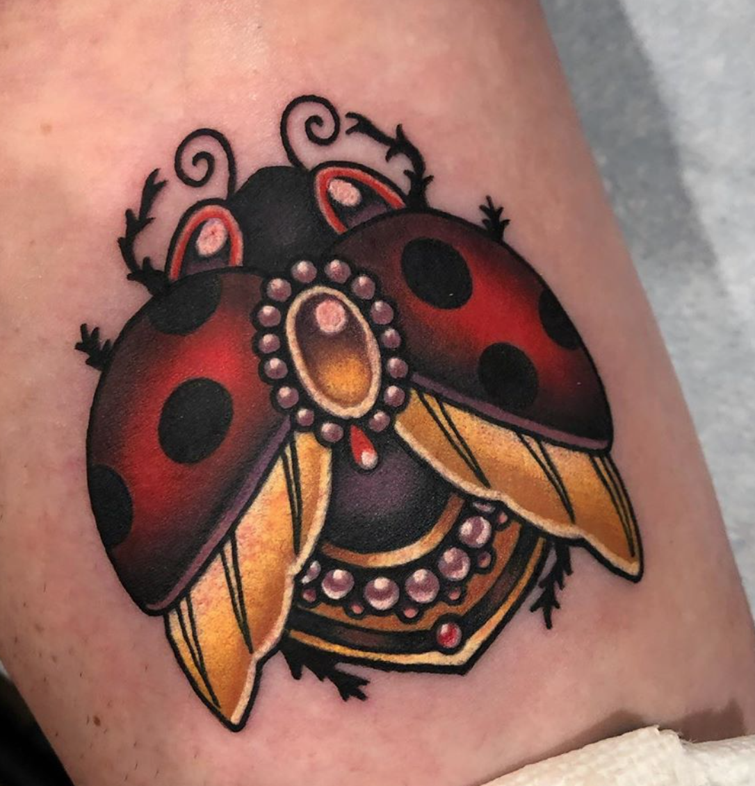 Neo traditional lady bug tattoo 