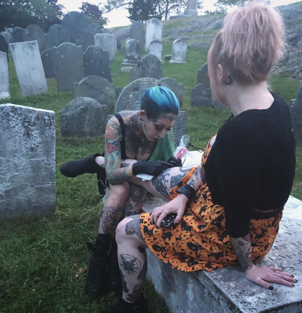 Alexandra Fische tattooing in a graveyard