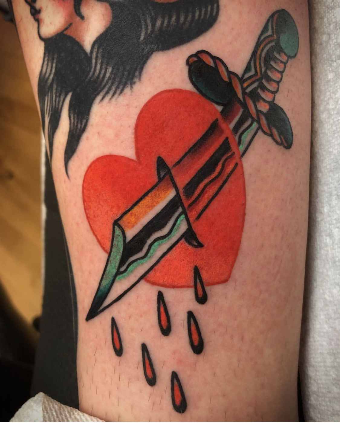 Traditional heart and dagger tattoo by Cassie Lynn Oneal