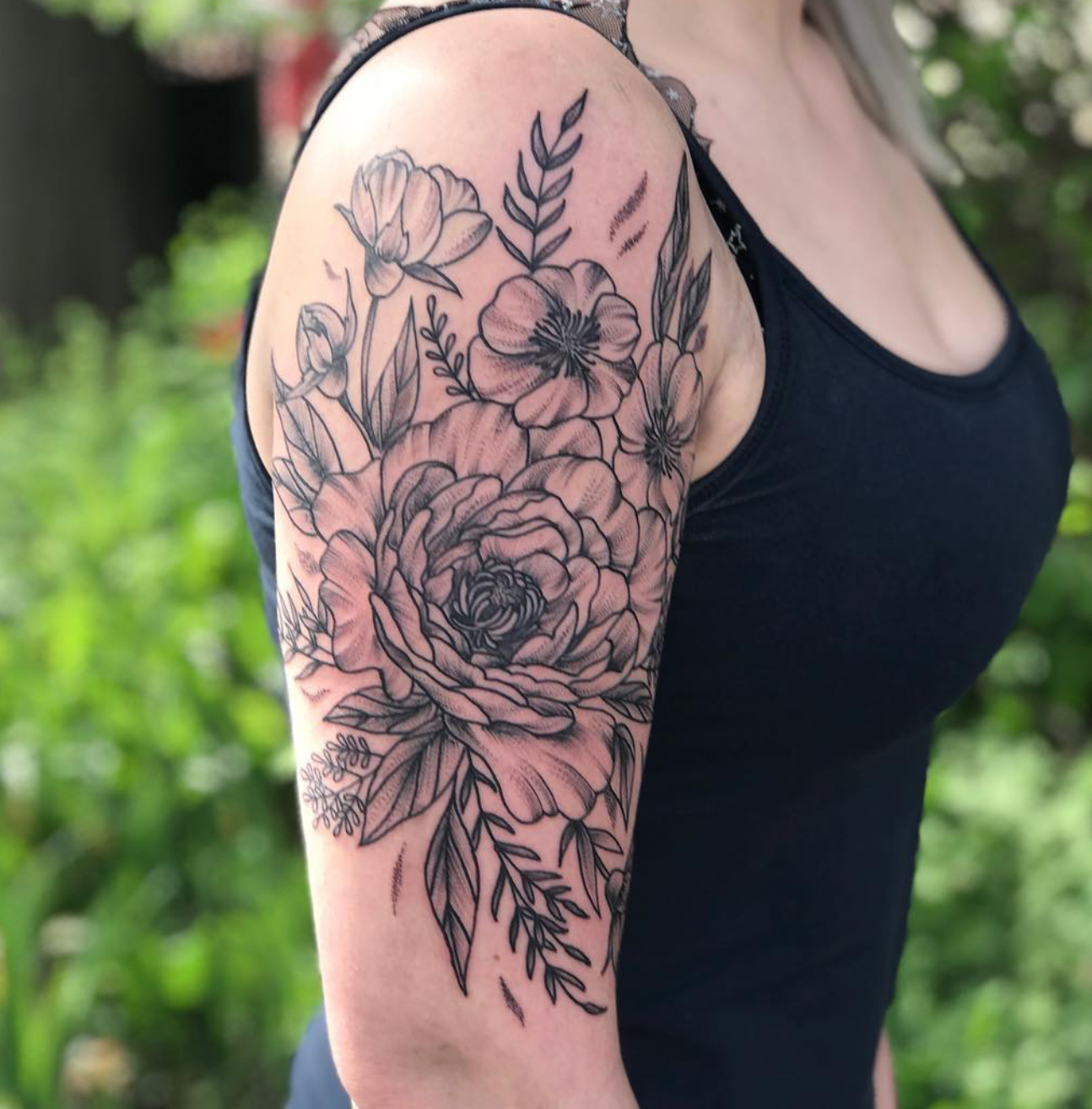Black and gray floral tattoo by Tara Morgan