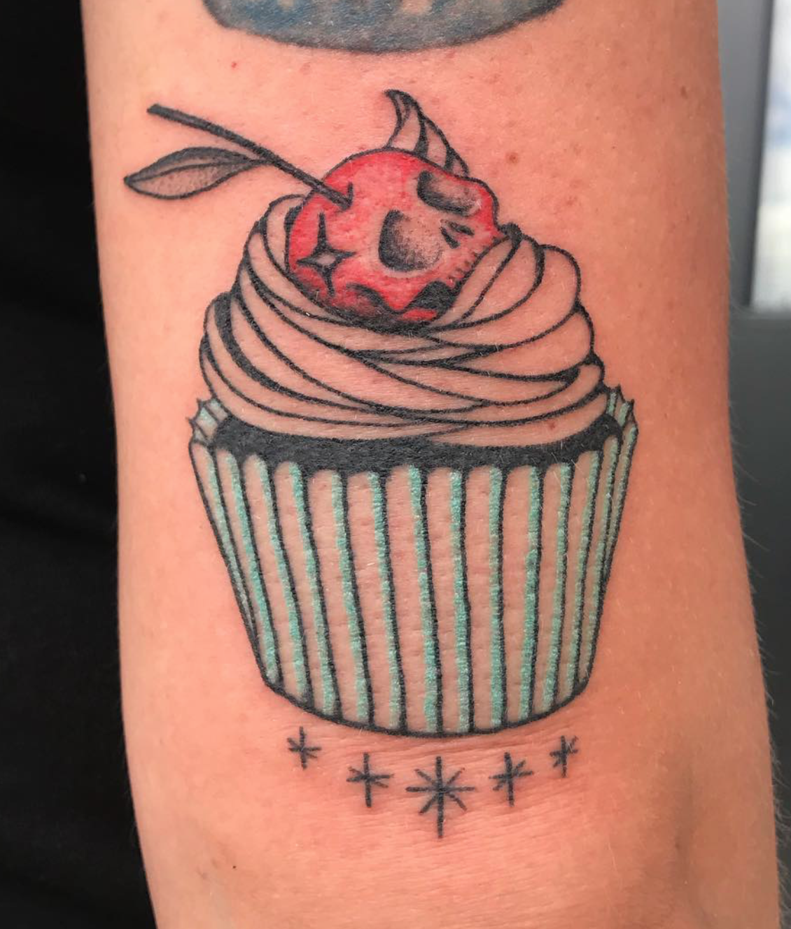 Skull cupcake tattoo by Rachel Patton
