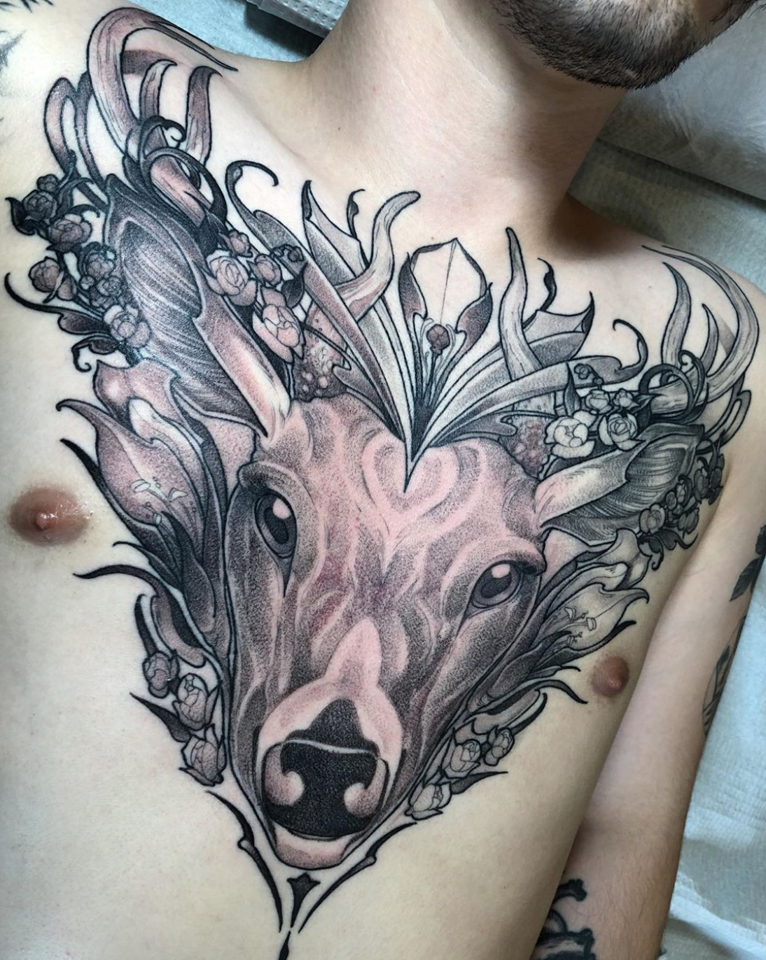 Deer chest piece tattoo by Kit Evans