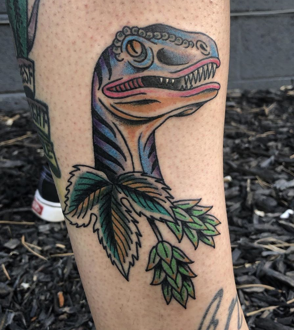 Dinosaur tattoo by Jessamyn Pusatory