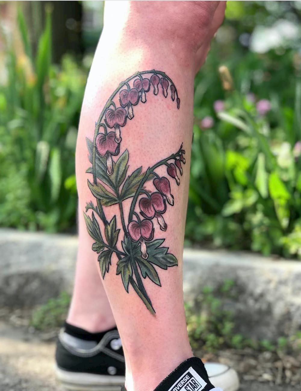 Tara Morgan floral leg tattoo