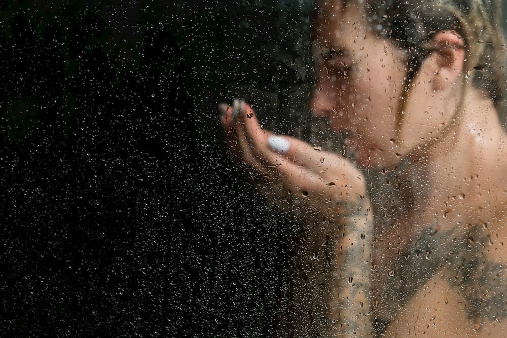 Woman washing her tattoo.